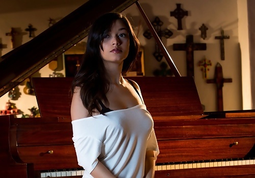 Eden Arya Beautiful Brunette Tempts on a Piano